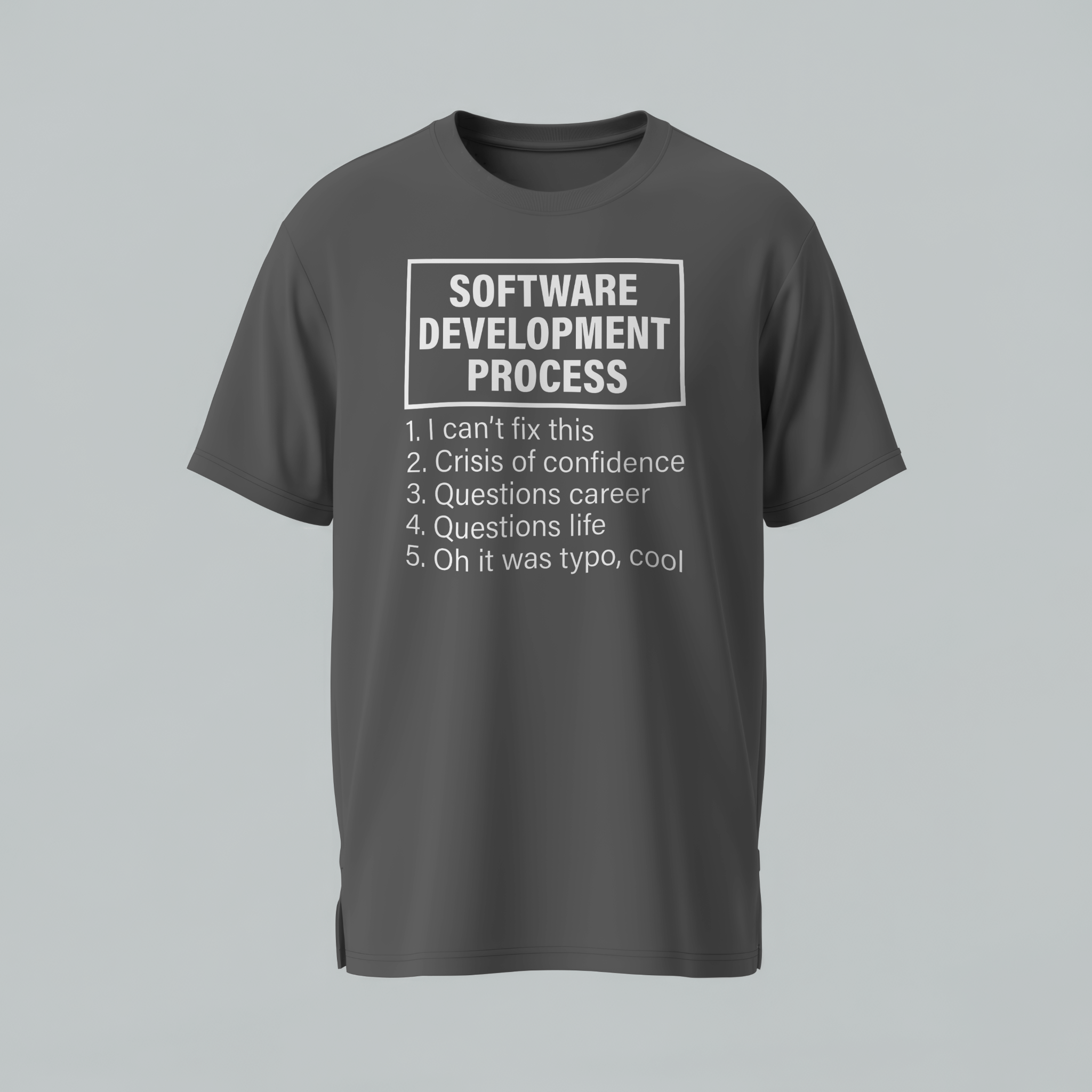 Gray t-shirt with humorous 'Software Development Process' text on a gray background