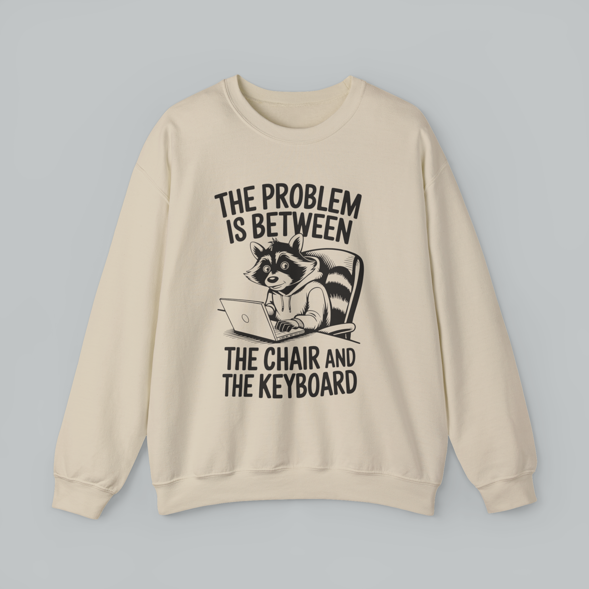 Beige sweatshirt with a graphic of a raccoon and text on a gray background