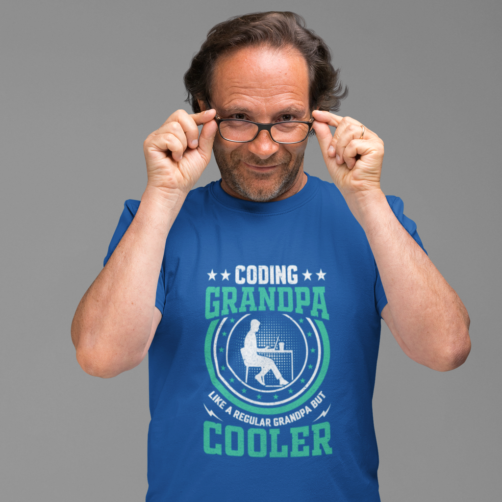 Man wearing a blue t-shirt with 'Coding Grandpa' text and graphic on a gray background