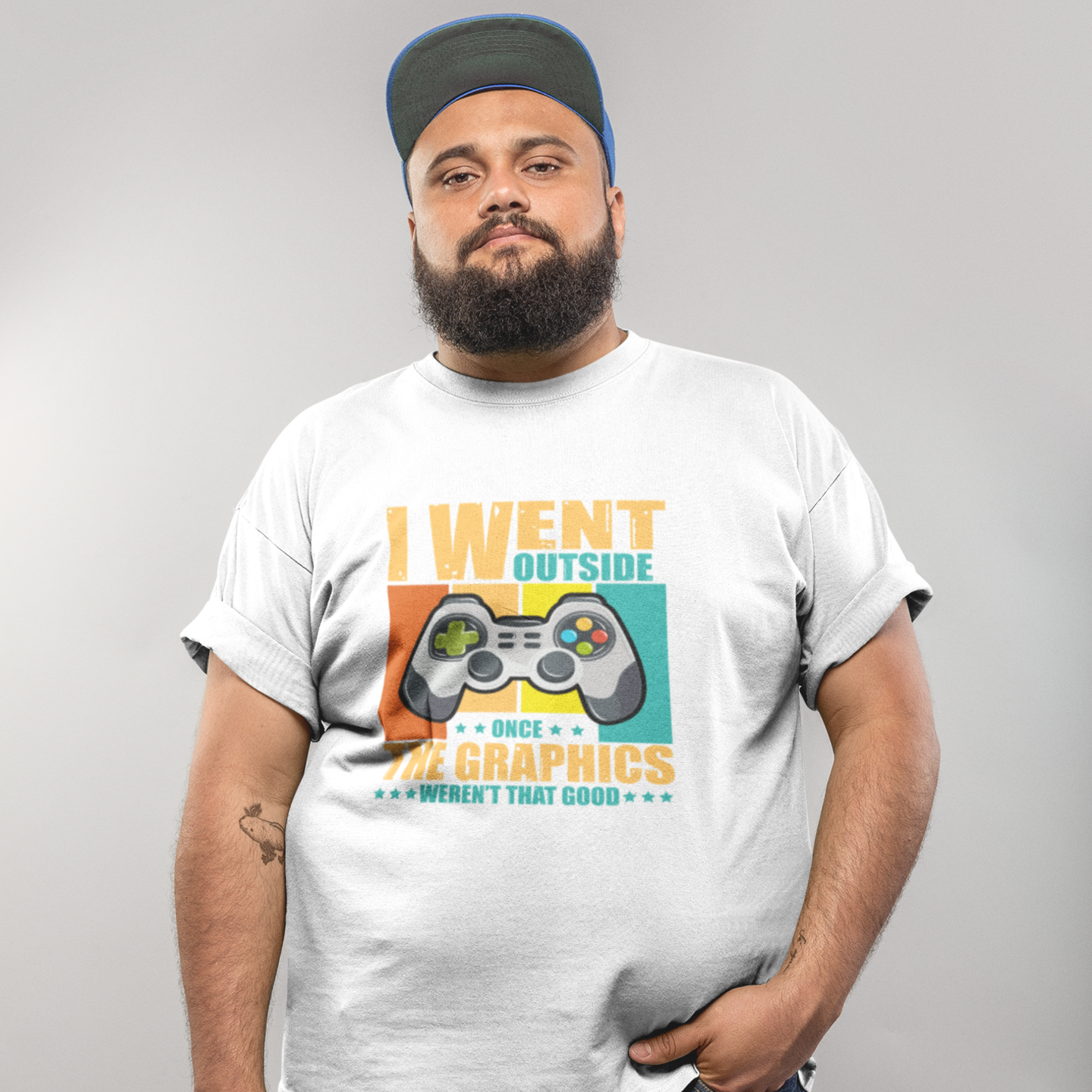 Person wearing a white t-shirt with a graphic design and text on a plain background